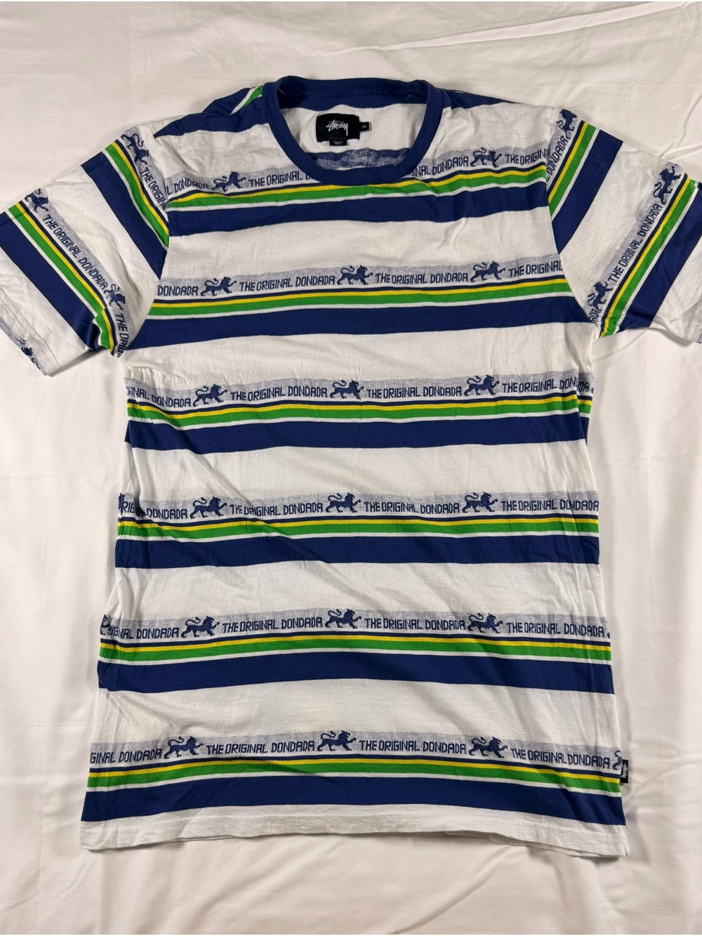 Stussy White Tee Shirt with Blue, Green & Yellow Striped Logo